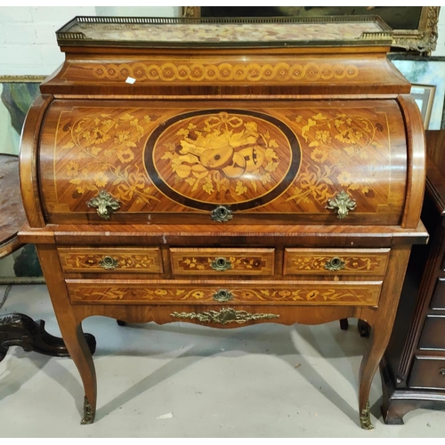 974 - A late 19th/early 20th century cylinder bureau in the Louis XVI manner, in marquetry with galleried ... 