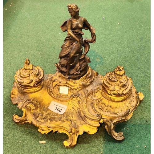 100 - A 19th century French brass and bronze inkstand in the rococo manner with semi clad female figure, 2... 