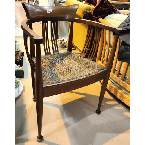 1004 - An Edwardian Art Nouveau armchair in inlaid mahogany, with squat cushion