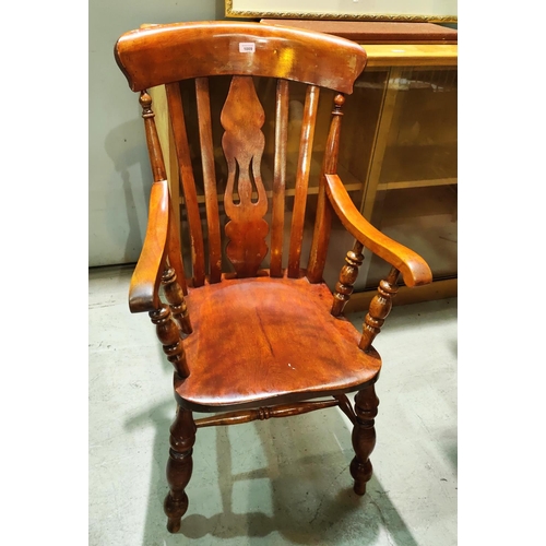 1009 - A Victorian ash and elm fiddle back carver chair with bobbin turned supports