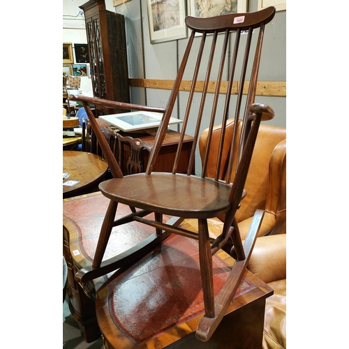 1022 - An Ercol rocking armchair with stick back