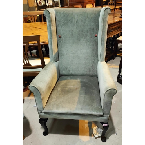 1025 - An early 20th century upholstered chair with H - shaped supports below, sage coloured upholstery, hi... 