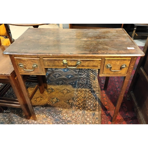 1028 - A Georgian cross banded oak lowboy with squared champhered legs, three drawers ht. 71cm x depth 32cm