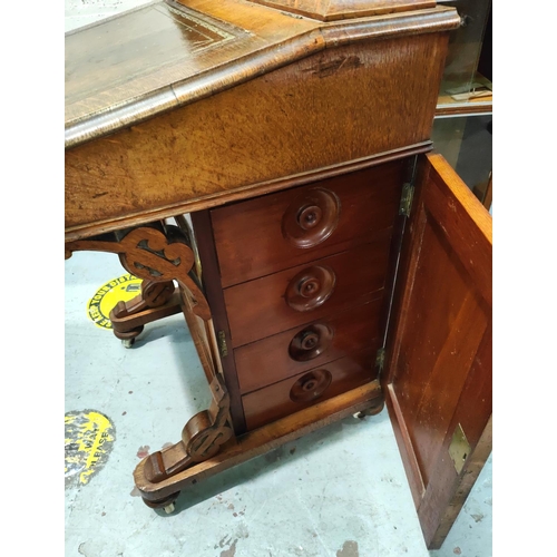 1036 - A Victorian oak Davenport with brown leather insert fitted interior in satin type wood and cupboard ... 