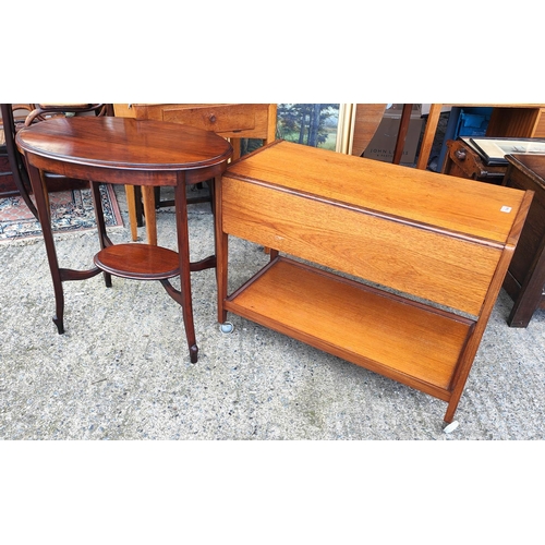 1044 - A mid 20th century teak two tier drinks trolley with drop leaves to each side and a mahogany oval oc... 