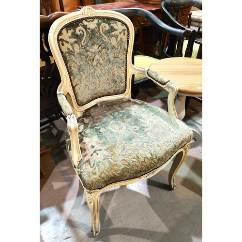 914 - A mid 20th century period style mahogany armchair on carved cabriole legs, in floral brocade upholst... 