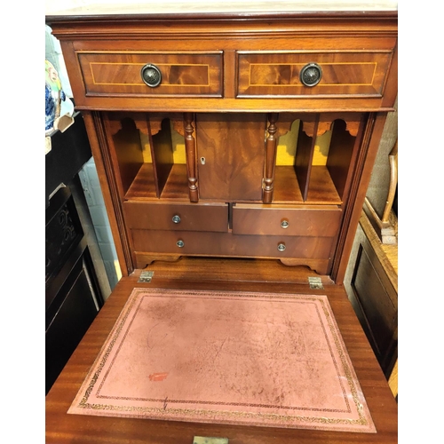 923 - A reproduction mahogany dwarf secretaire/side cabinet with fall front and fitted interior over 4 dra... 