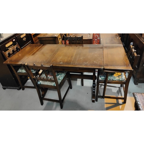 930 - An Ecrol draw leaf refectory dining table and four chairs matching Ercol chairs (2+2)