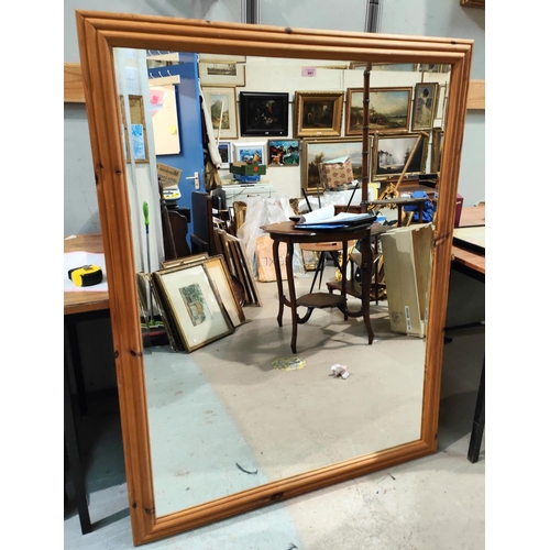 941 - A large modern rectangular pine framed mirror, bevelled glass 104 x 134cm