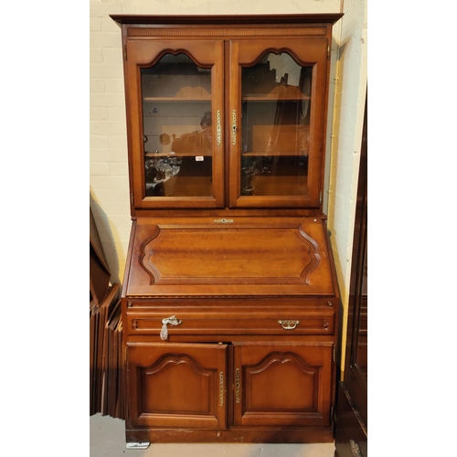 943 - A cherrywood bureau bookcase with fall front, single drawer and double cupboard to base