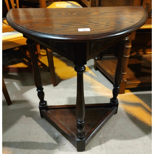 947 - An oak demilune side table with shelf under