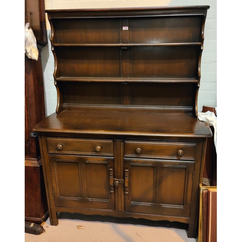 948 - An Ercol modern high back dresser with plate rack over double cupboards, height 161cm, length 120cm