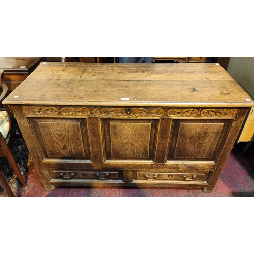 951 - A late 18th/ early 19th century country made oak mule chest with hinged plank top, carved frieze, 3 ... 