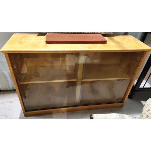 954 - A modern figured ash bookcase/display cabinet enclosed by glass doors