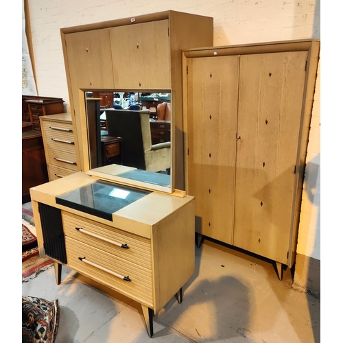 963 - A 1950's 'Link' limed wood bedroom suite comprising double wardrobe, gent's fitted wardrobe and 4 he... 