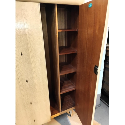 963 - A 1950's 'Link' limed wood bedroom suite comprising double wardrobe, gent's fitted wardrobe and 4 he... 