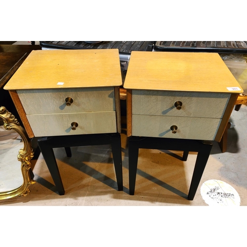 965 - A 1950's pair of designer bedside cabinets in light oak, each with 2 grey drawers, on ebonised bases... 