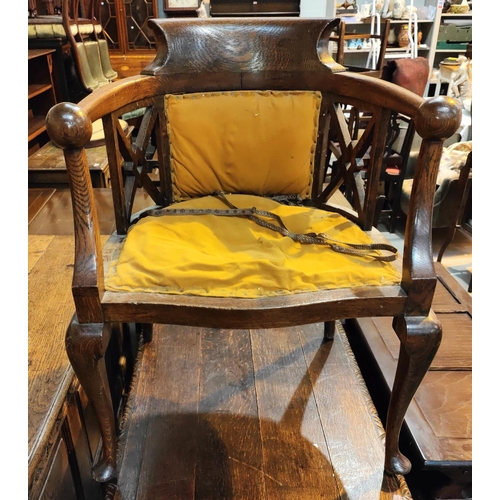 977 - A mahogany Georgian style armchair, tub shaped with ball armrests, on cabriole legs, gold upholstery