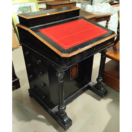 979 - An Aesthetic Movement Daven port desk, ebonised with burrwood crossbanding, having raised correspond... 