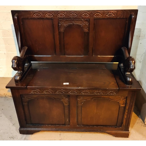 986 - An oak reproduction monks bench with box seat