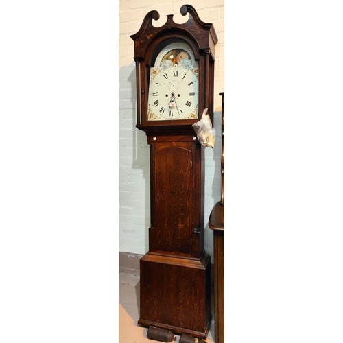 992 - An early 19th century oak longcase clock with swan neck pediment and reeded side columns to the hood... 