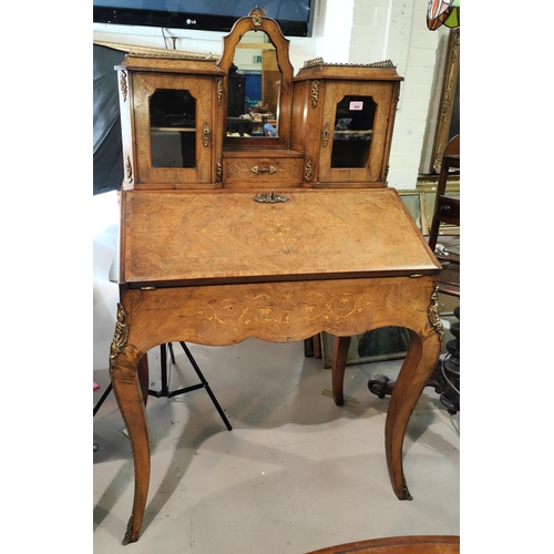 996 - A 19th century French walnut bureau de dame crossbanded in kingwood and with boxwood inlaid decorati... 