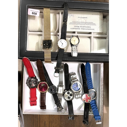 608 - A selection of gents fashion watches and a watch storage case