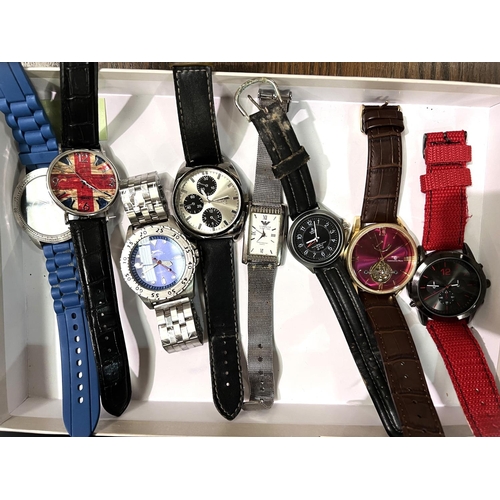 608 - A selection of gents fashion watches and a watch storage case