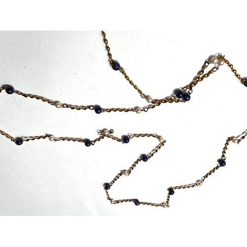 616 - A yellow metal twisted link necklace, stamped '9ct', set alternating pearls and lapis lazuli coloure... 