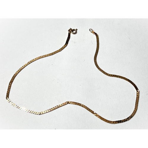 689 - A 9 carat hallmarked gold necklace formed from flattened curb links, 6.4gm.  15 inches long.