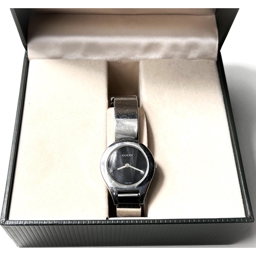 692 - A lady's Gucci wristwatch, chromium plated on matching bracelet, in original box with 'lifetime' bat... 