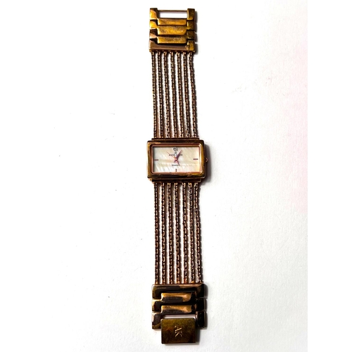 693 - A lady's dress watch by Anne Klein, in gilt metal with 5 strand woven strap and 'lifetime' batt... 