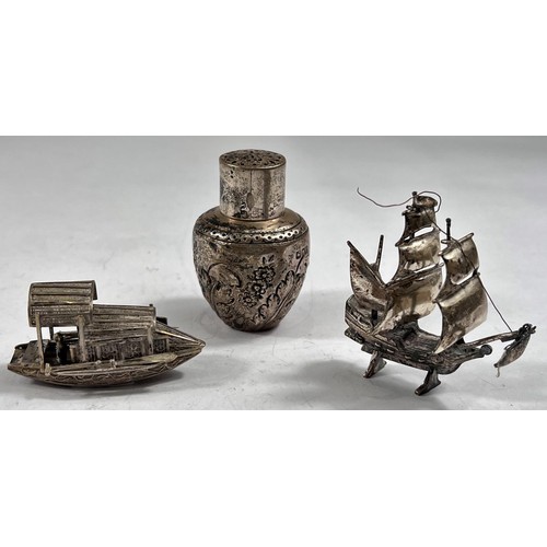 761 - A white metal miniature 3-masted galleon; a white metal miniature oriental boat; a small embossed po... 