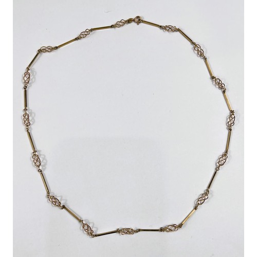 712 - A yellow metal necklace formed from alternating open twist and elongated links, st. 375 10.9gm, leng... 