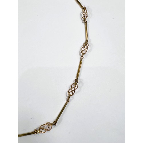 712 - A yellow metal necklace formed from alternating open twist and elongated links, st. 375 10.9gm, leng... 