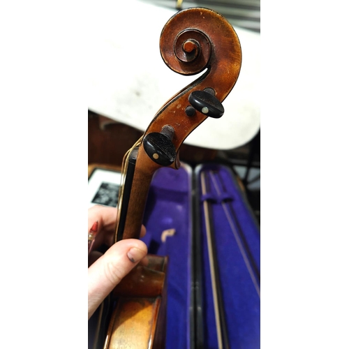 336A - A late 19th early 20th century two piece back violin, bearing paper label for Copie de Antonius Stra... 