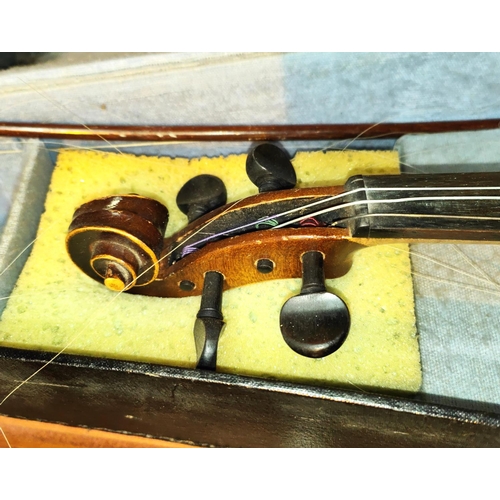 337 - A 20th century full size violin with double piece back, scrolling head, bow with mother of pearl ins... 