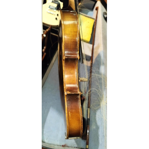 337 - A 20th century full size violin with double piece back, scrolling head, bow with mother of pearl ins... 