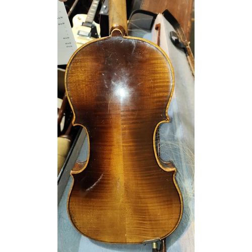 337 - A 20th century full size violin with double piece back, scrolling head, bow with mother of pearl ins... 