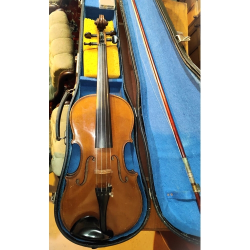 338 - A 20th century full size violin with two piece back, scrolling head, bow, fitted hard carry case