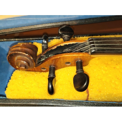 338 - A 20th century full size violin with two piece back, scrolling head, bow, fitted hard carry case