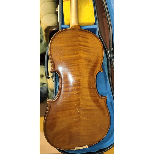 338 - A 20th century full size violin with two piece back, scrolling head, bow, fitted hard carry case