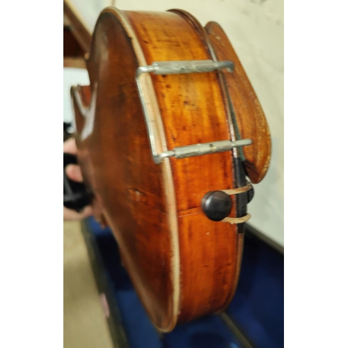 340 - A late 19th early 20th century full sized violin with two piece back wooden chin rest, in wooden fit... 