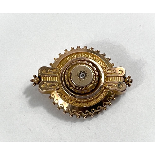 823 - A 19th century memorial target brooch set with a rose cut diamond, tested 15ct 10.2gms gross/6.4gms ... 