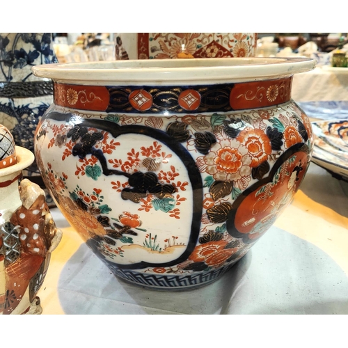 354 - A Japanese imari jardiniere with people and flowers decorating the panels, a Japanese satsuma sleeve... 