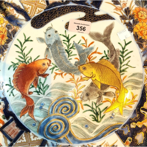 356 - A large Chinese Imari circular wall plaque decorated with carp different colours to the centre, bird... 