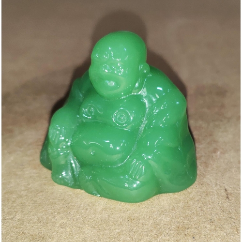 365A - A Chinese jade coloured glass figure of Ho-tai 