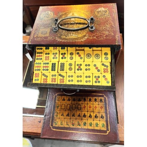 384B - A Chinese cased Mahjong set with drawers and decoration to the exterior, another set