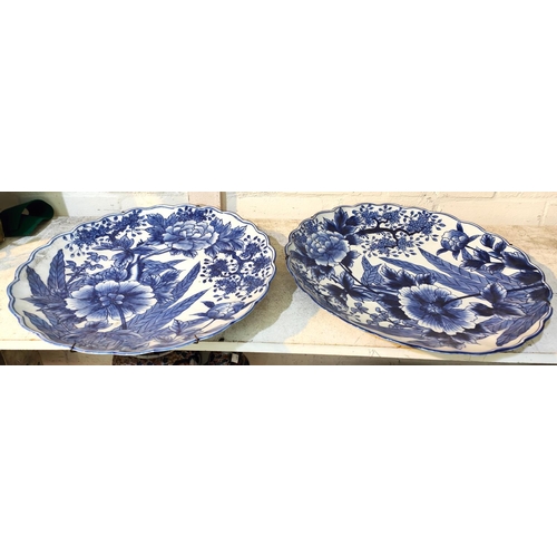 416A - A large pair of Japanese blue and white chargers with shaped edges, a similar small selection of blu... 