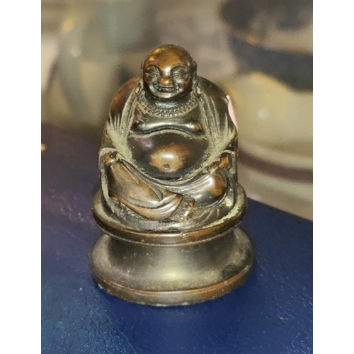 452 - A miniature Chinese bronze Buddha weight, seated position, height 5cm